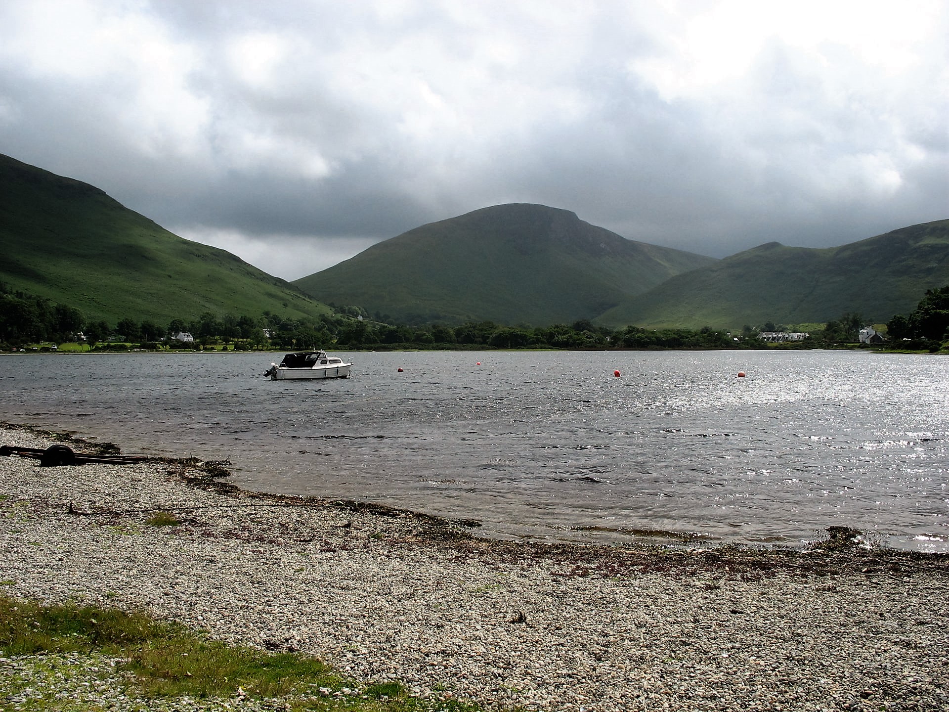 Pebble beach, water and mountains