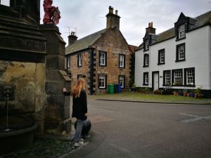 Girl standing at the fountain in Falkland