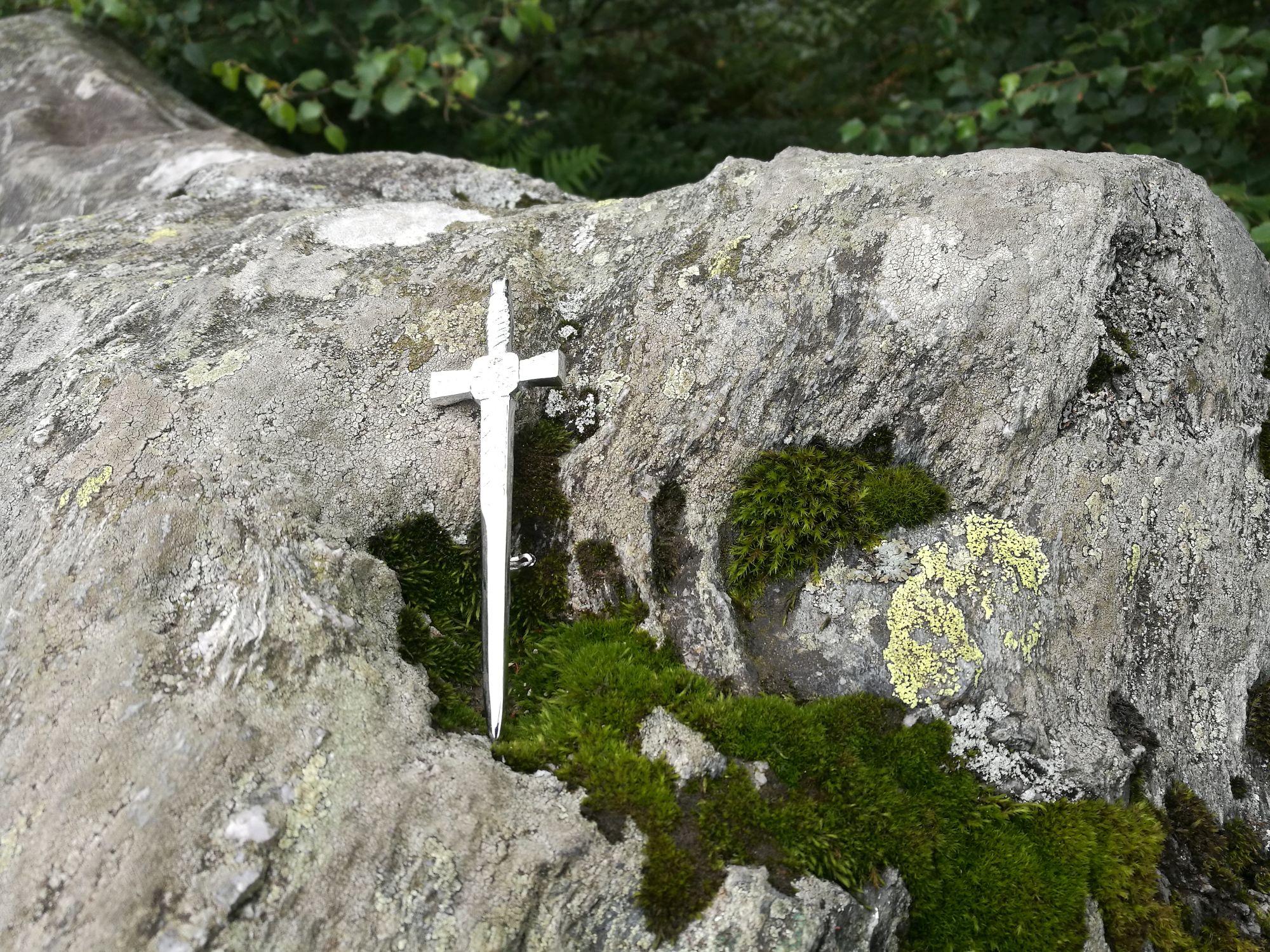 A tiny sword on a rock