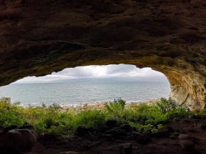 View of the ocean from inside a cave
