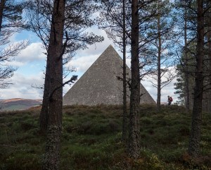 Tall pyramid style cairn through the trees. Size is 42 feet by 42 feet.