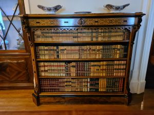 Old book sheld holding lots of old books