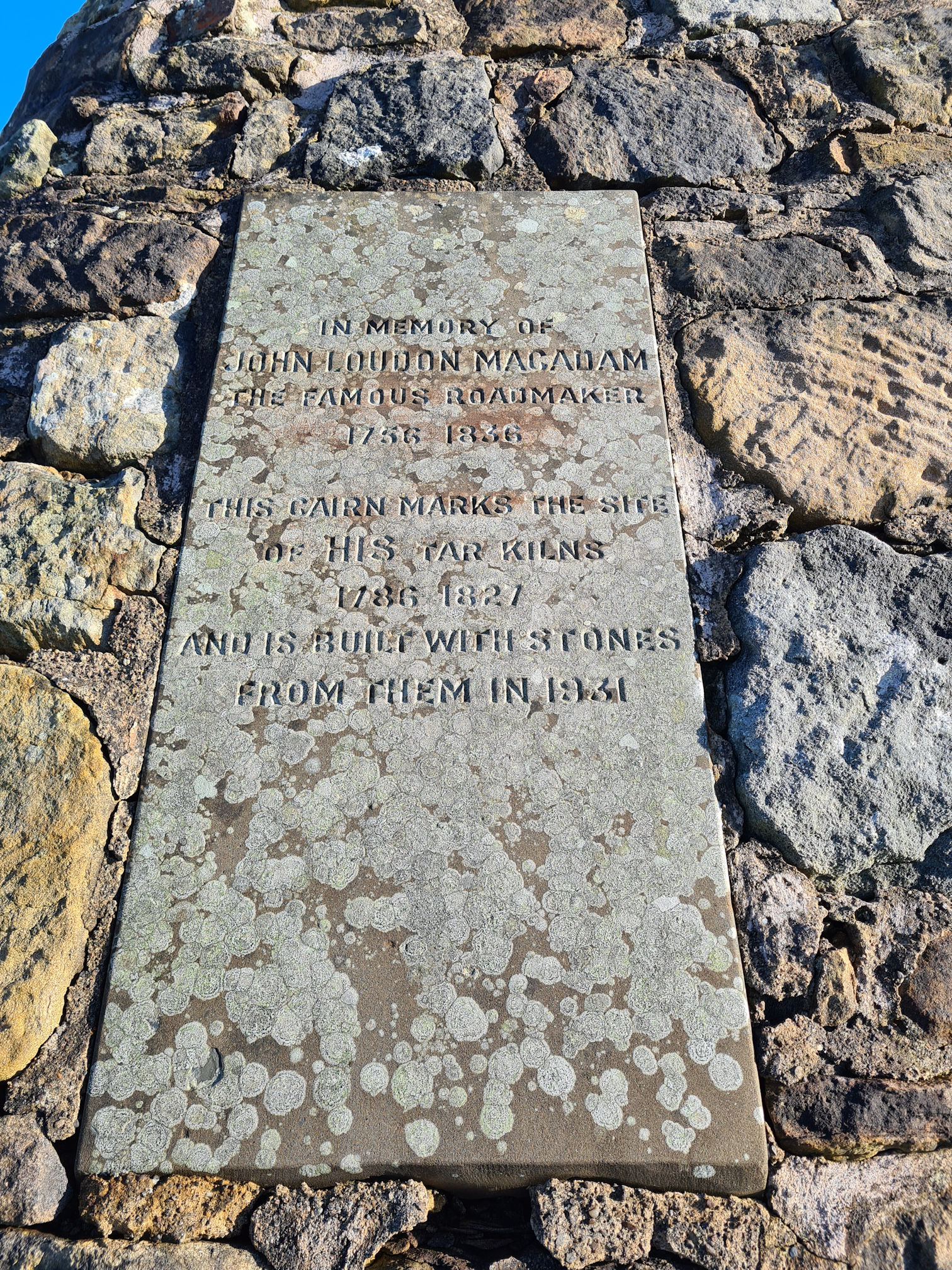 Stone cairn inscription in memory of road maker John Loudon McAdam