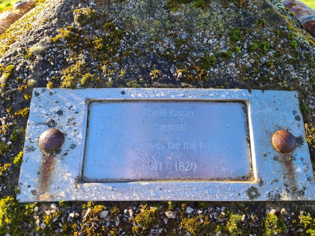 Tibbie Pagan's memorial plaque, mounted to a stone monument