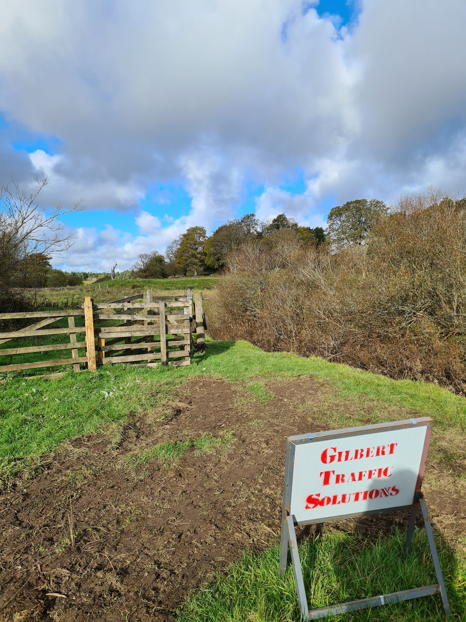 A sign confirming that the path and gate ahead are undergoing improvements