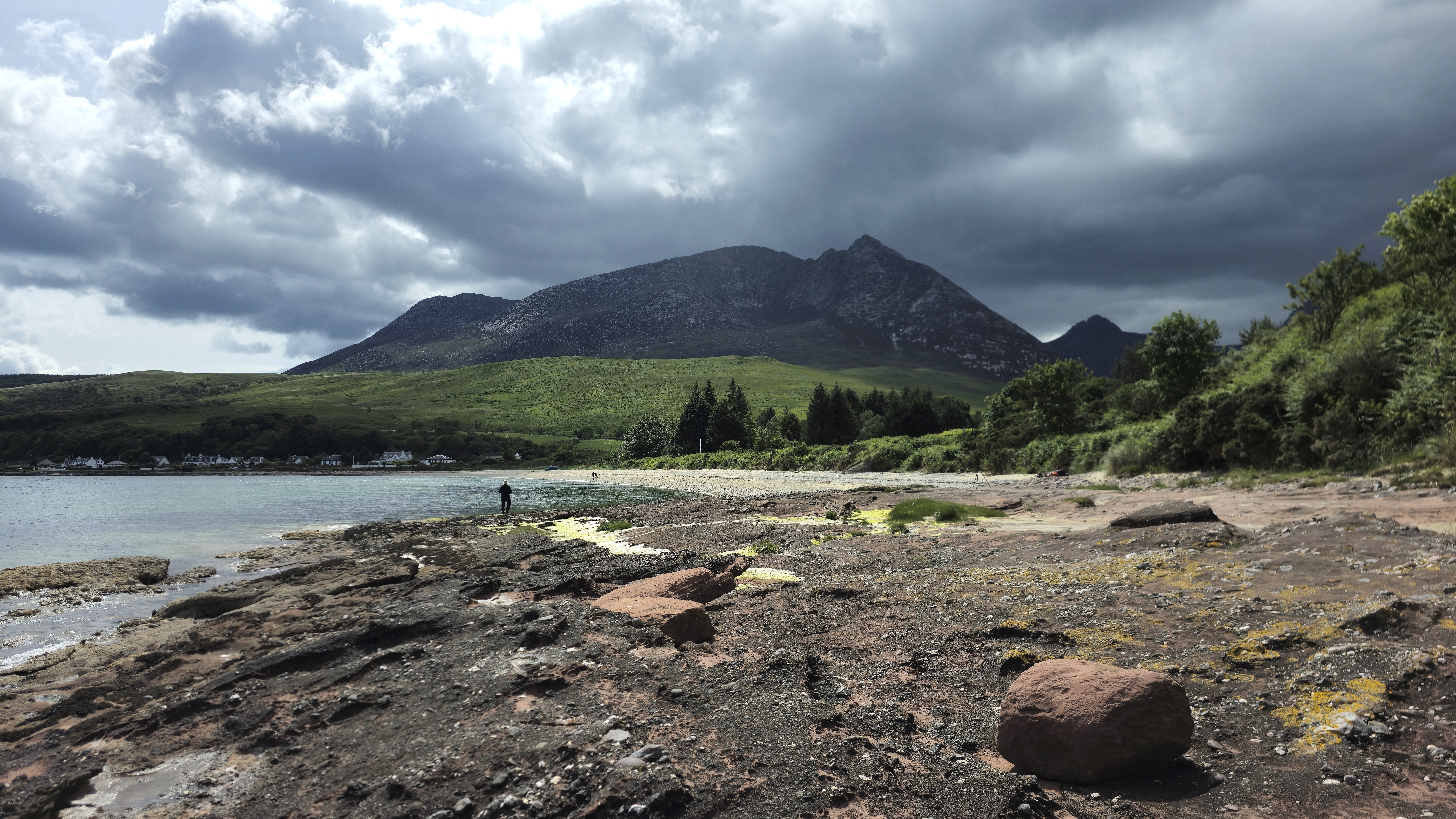Sandstone rock, mountains and the sea