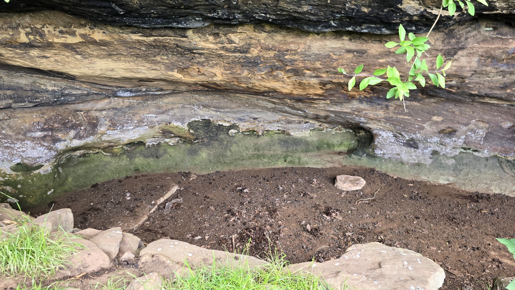 A wide but shallow cave known as Saint Molaise's Cave