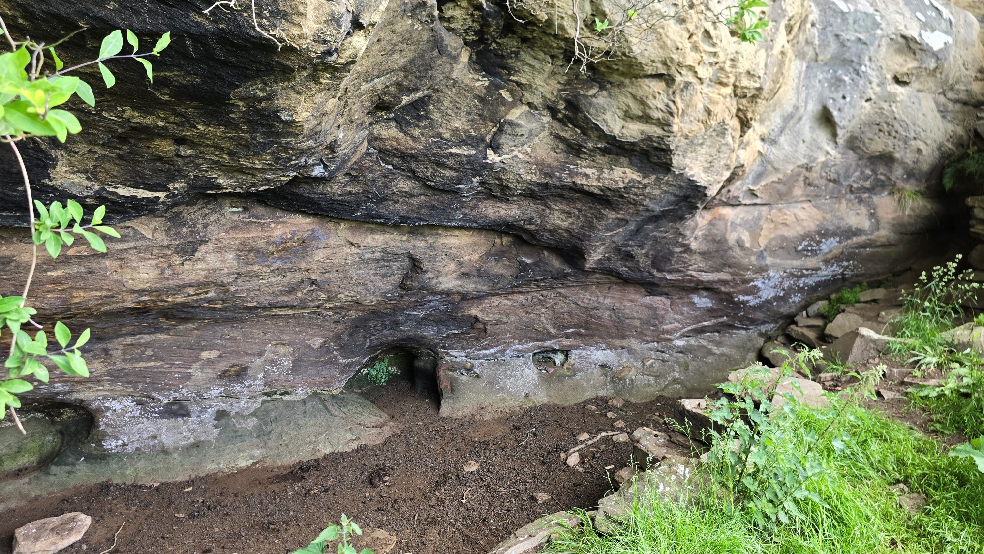 A wide but shallow cave known as Saint Molaise's Cave