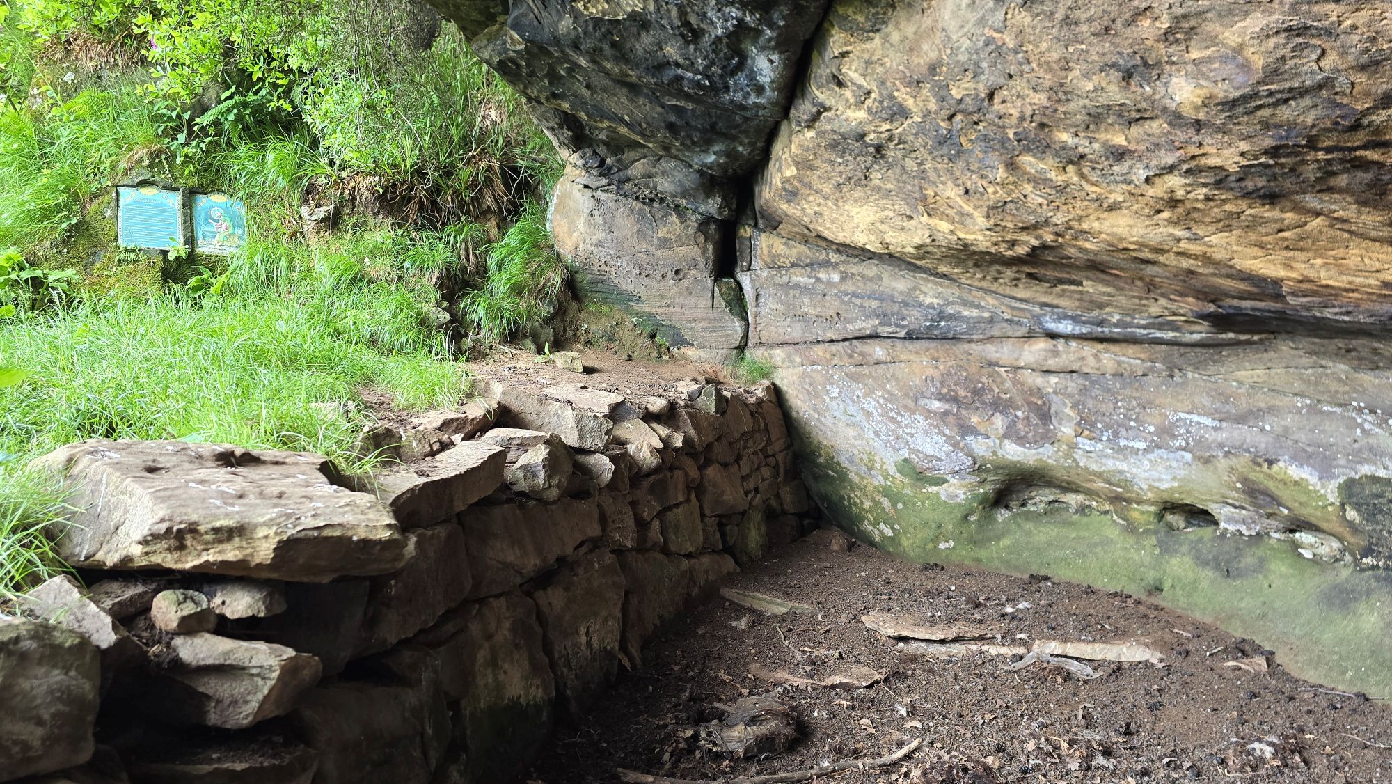 A wide but shallow cave known as Saint Molaise's Cave
