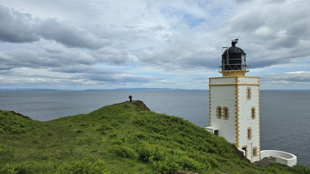 Pillar Rock Lighthouse, a square tower perched on the coastline of Holy Isle