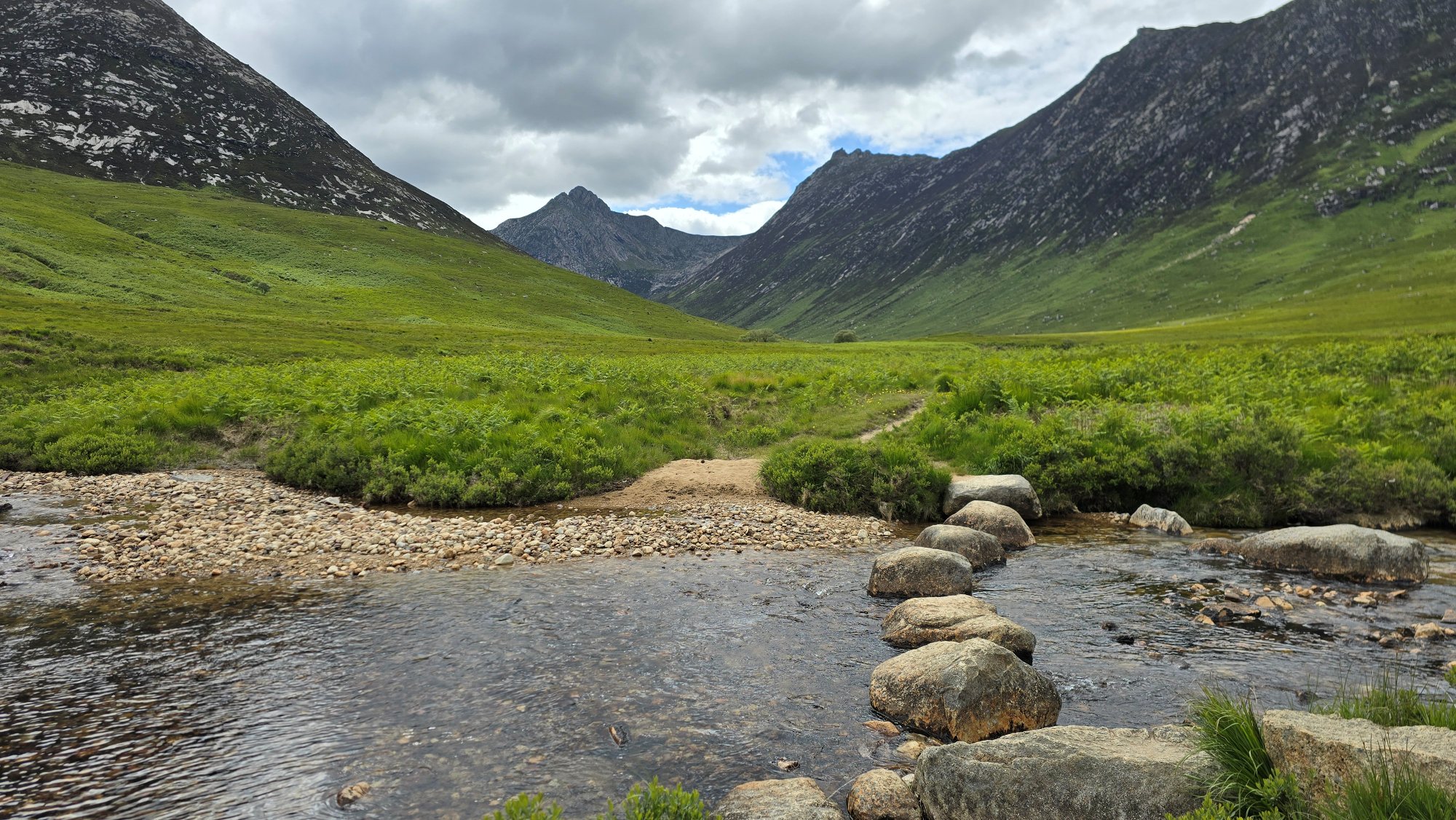 Large boulders across a burn, used as stepping stones to cross the water into Glen Sannox