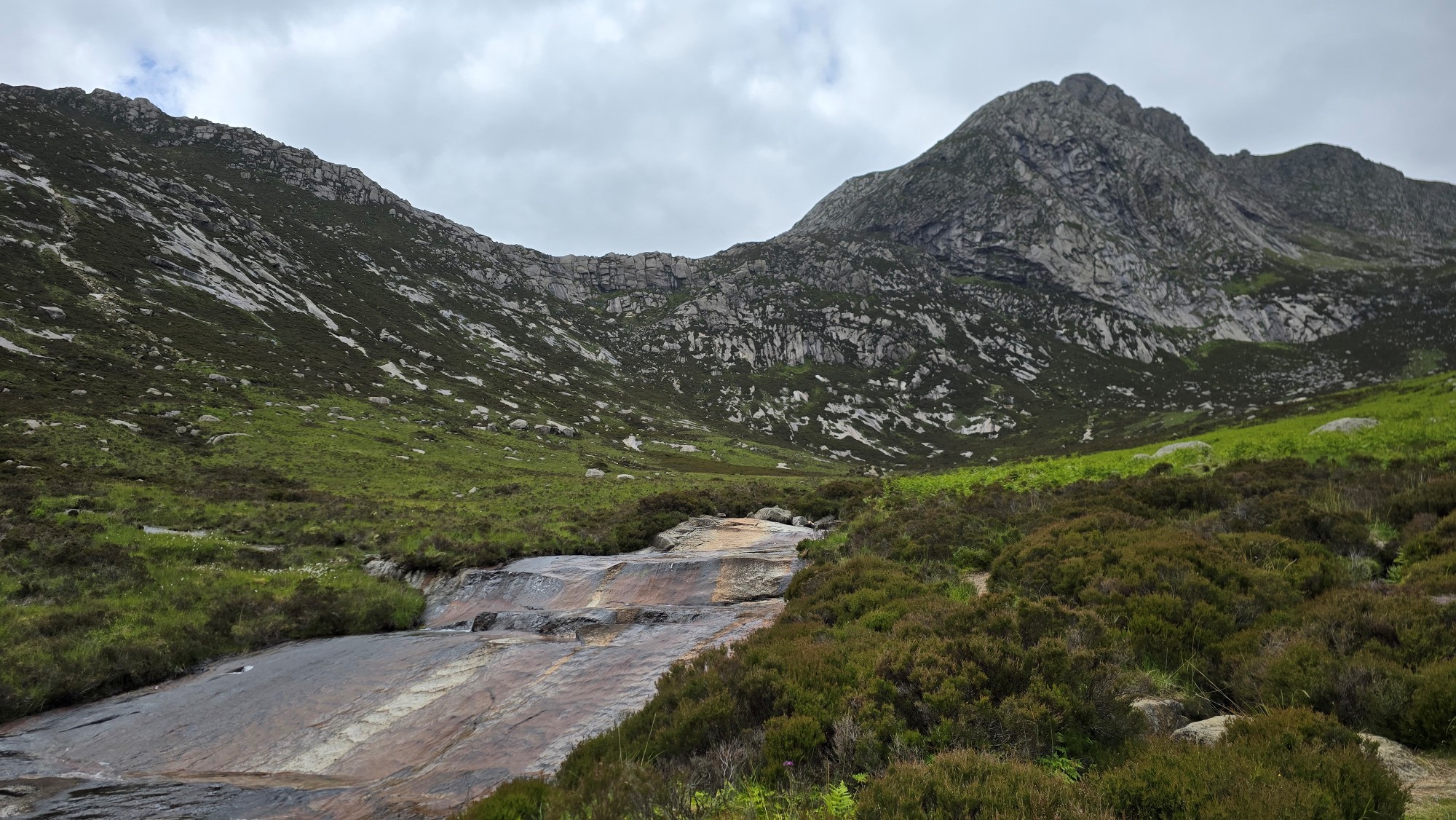 Water from the Sannox Burn and mountain peaks all around