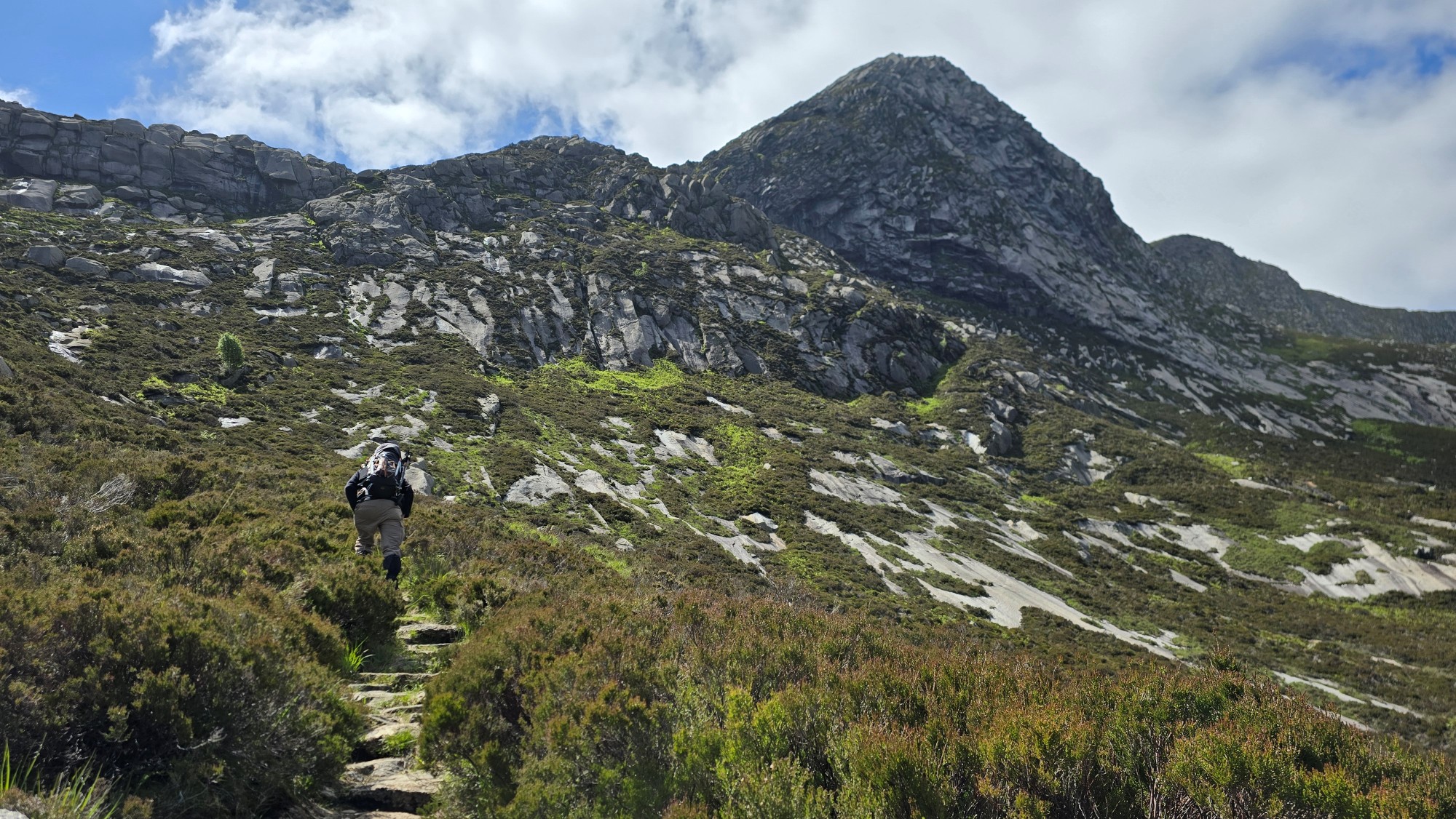 Man hiking up a mountain