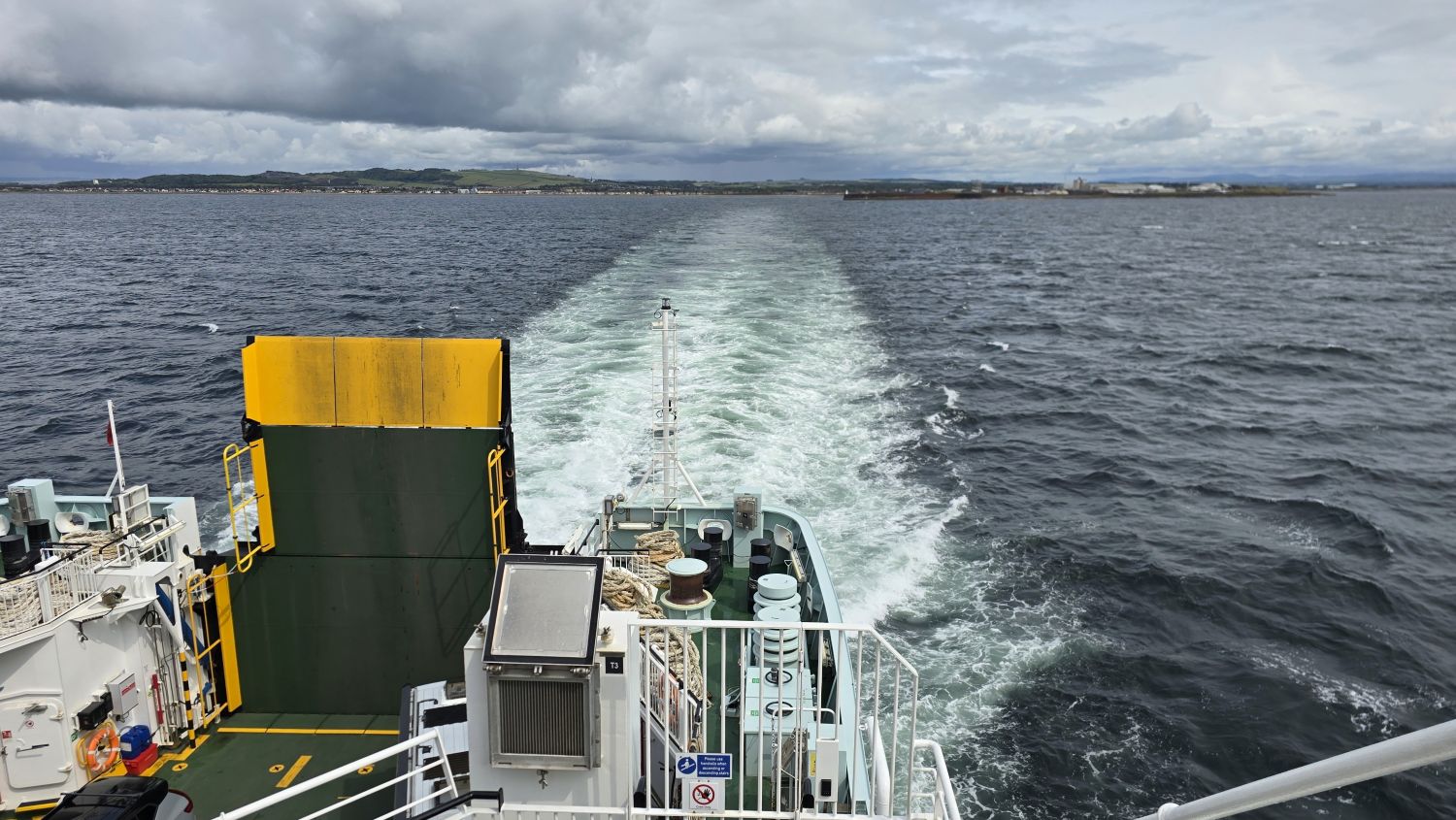The stern of the ferry and sailing away from Troon