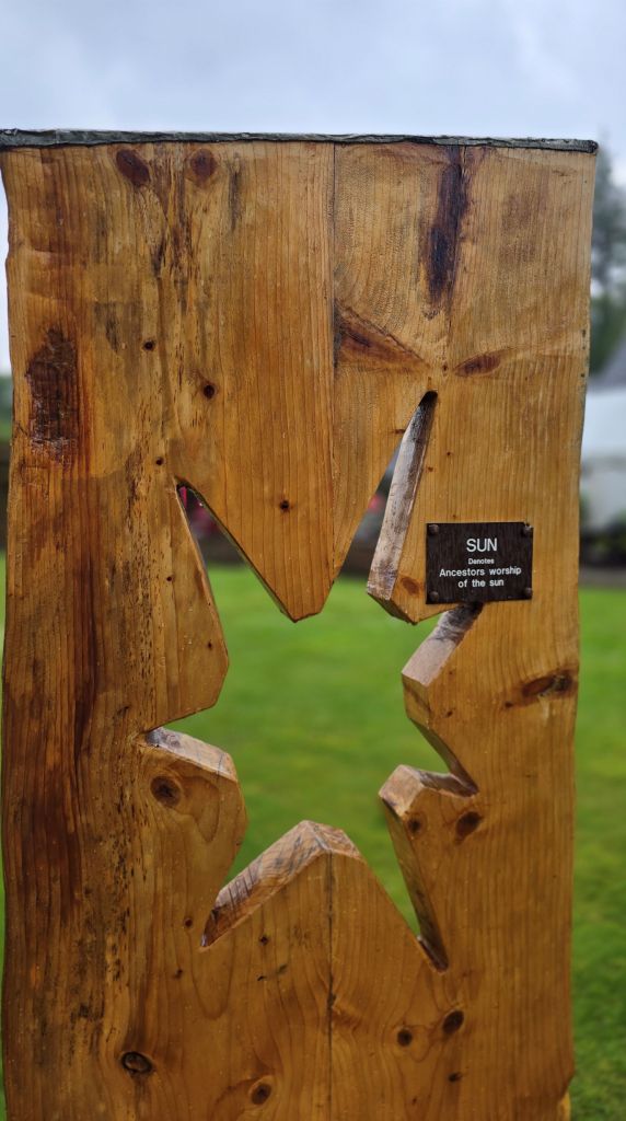 Shape of the sun as part of a wooden seat