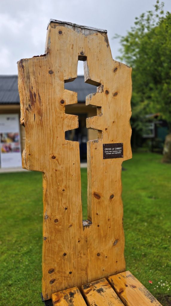 Shape of a Cross of Christ as part of a wooden seat