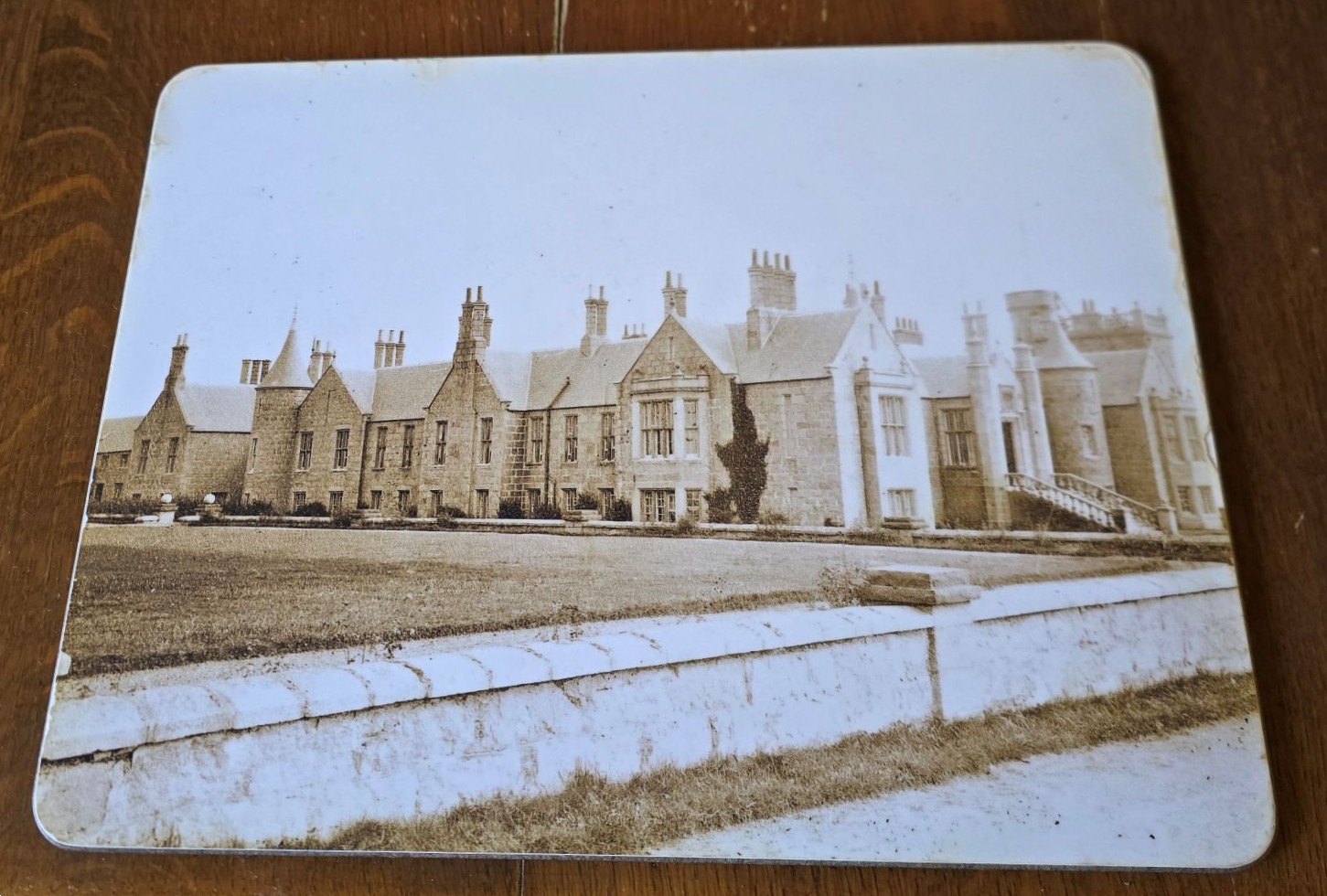 A placemat showing an old photo of Slains Castle